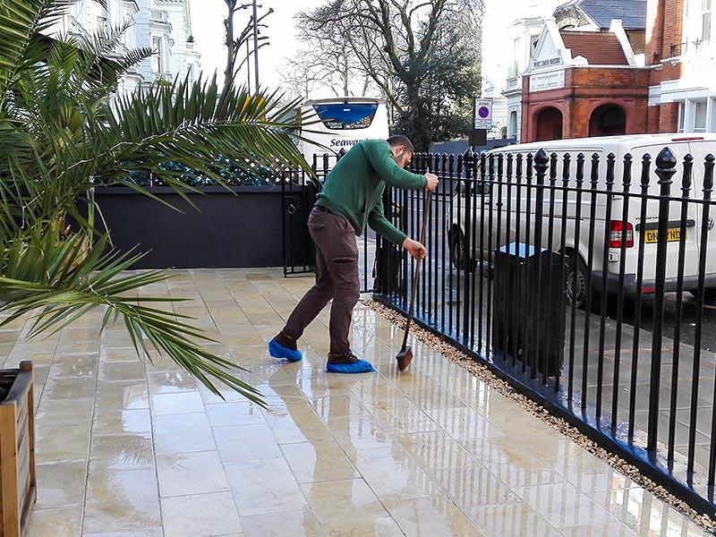 mopping tiles after pressure washing